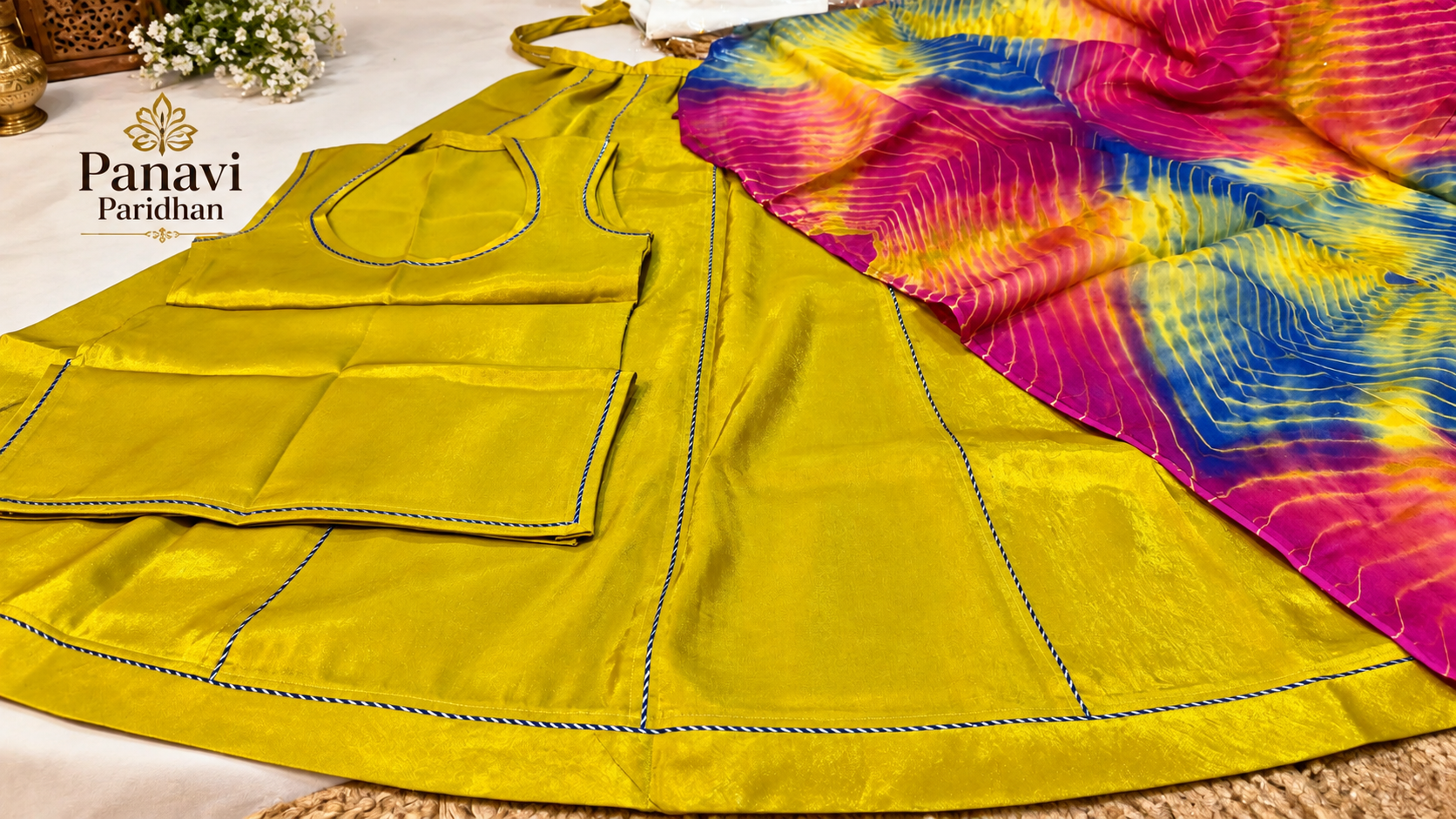 Glocy Fabric Suit with Shibori Pure Odhni – Mustard Yellow Multicolor | Panavi Paridhan Alt Text: Beautiful Mustard Yellow Glocy Fabric Rajputi Suit with Multicolor Shibori Pure Odhni and Elegant Blue Piping – Panavi Paridhan